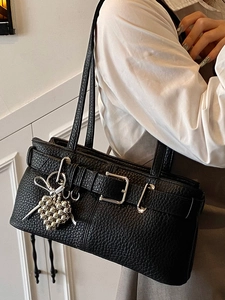 Chic black litchi pattern shoulder bag with belt buckle and heart charm pendant