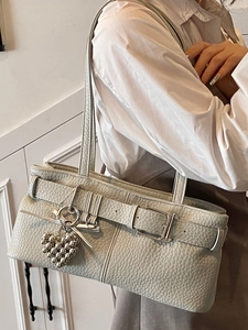 Chic light green pebbled leather shoulder bag with silver buckle and metallic heart charm