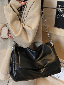 Minimalist black soft leather crossbody bag with silver chain strap for women