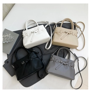 Litchi pattern crossbody bags in white, beige, black, and grey with bow detail