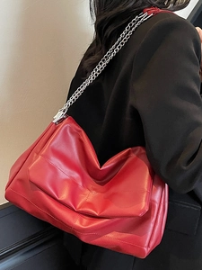 Minimalist red leather chain crossbody bag for women with ruched design and silver strap