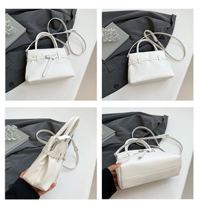 Detailed views of white lychee leather handbag showing stitching and detachable strap
