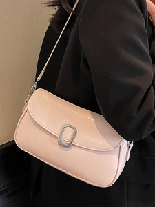 Chic light pink underarm bag in glossy PU leather with silver oval buckle and slim strap