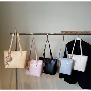 Group of colorful matte PU leather tote bags in five shades with cute bear charms