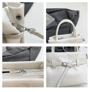 Detail view of white lychee pattern leather handbag with silver hardware and stitching