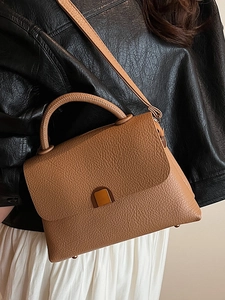 Minimalist brown lychee pattern leather handbag with gold metal clasp and top handle