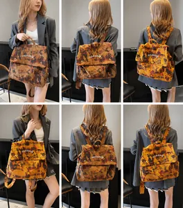 Multiple views showing large camouflage backpack worn as handbag and shoulder bag