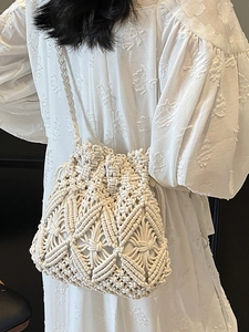 Chic woven macrame bucket bag in cream white for beach and bohemian summer styling
