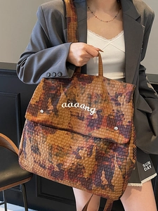 Large camouflage tote bag with orange patterns and wide shoulder straps for daily use