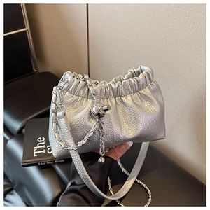 Detailed close-up of metallic silver pleated cloud bag with shiny PU leather and chain strap