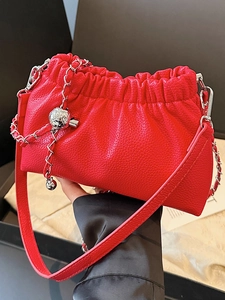 Minimalist red leather cloud bag with drawstring and silver chain strap for women