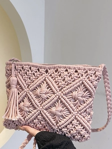 Handmade pink woven cotton rope shoulder bag with bohemian tassels and mesh design