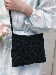 Handmade black woven cotton rope shoulder bag with tassel charm and geometric pattern