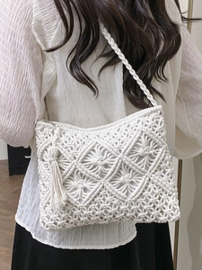 Handmade woven cotton rope crossbody bag with tassels and diamond mesh pattern