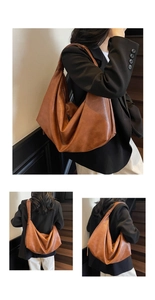 Detail view of slouchy brown hobo bag showing supple leather texture and wide strap