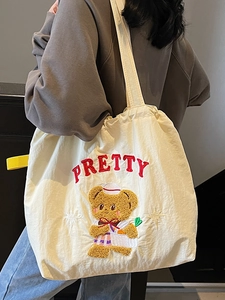Cream tote bag with cute cartoon bear embroidery and PRETTY lettering for daily use