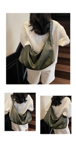 Detail view of large olive green oil-wax leather tote with wide shoulder strap
