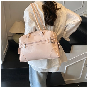 Close-up of pink high-capacity bowling tote bag featuring metallic zipper and side pockets