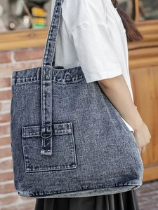 Minimalist large capacity denim tote bag with vintage wash finish and shoulder strap