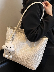 Sac cabas beige à motifs floraux en jacquard avec un joli pendentif en peluche
