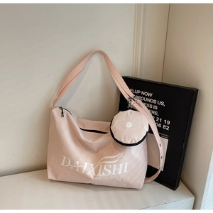 Detail of pink waterproof nylon tote bag with small detachable zipper coin purse