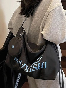 Large black crossbody canvas bag with matching mini pouch and logo for daily commute