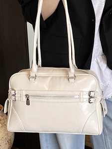 Minimalist off-white bowling handbag in glossy synthetic leather with silver buckles