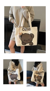 Three views of a cream canvas tote bag with a cute bear print and plush charm