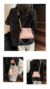 Pink pleated bucket bag with brand label and metallic chain strap shown in various angles