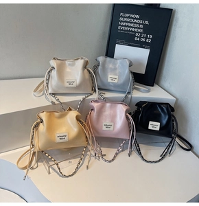 Detailed close-up showing five colors of drawstring mini bucket bags in high-quality PU leather