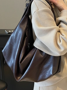 Brown leather oversized hobo bag for women with slouchy minimalist daily commuter style