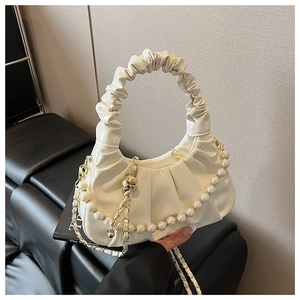 Detail of off-white cloud handbag with pearl chain and pleated leather handle