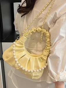 Yellow pleated cloud bag for women with pearl handle and golden chain strap