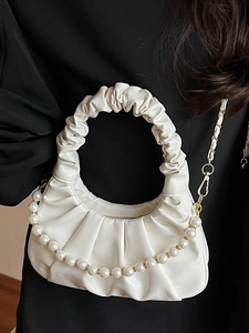 White pleated cloud handbag with elegant pearl strap and metallic gold chain shoulder strap