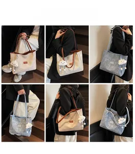 Detailed views of the large floral embossed tote bag with braided handles and cloud charm