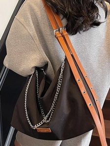 Fashionable dark brown tote bag with leather straps and silver chain for women