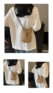 Detail view of the khaki nylon drawstring crossbody bag with woven patterned shoulder strap