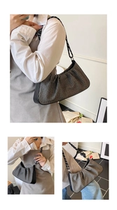 Detail of retro woven pattern shoulder bag with distinctive thick black and white rope strap