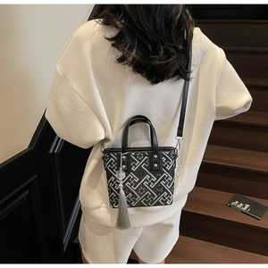 Classic Chinese style bucket bag with Greek Key patterns and stylish grey tassel detail