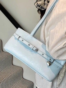 Minimalist light blue patent leather underarm bag with silver heart charm and metal buckle