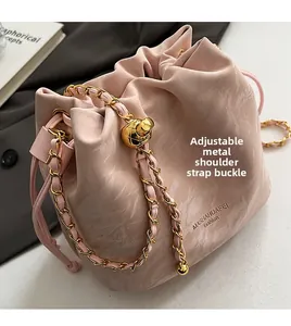 Pink marble pattern bucket bag with adjustable gold chain strap and metal ball buckle