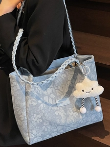 Floral light blue tote bag with woven straps and a cute white cloud plush pendant