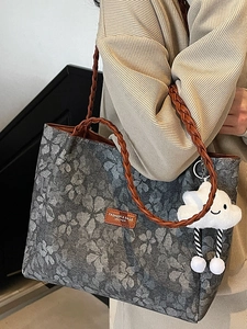 Retro grey tote bag with floral patterns, brown woven straps, and white cloud charm