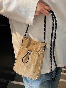 Mini nylon drawstring crossbody phone bag in khaki with patterned rope strap