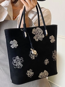 Elegant Chinese style black bucket bag with gray floral patterns and silver pomegranate charm