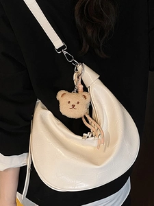 White crocodile pattern half-moon shoulder bag with cute bear charm and adjustable strap