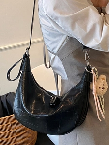 Minimalist black crocodile pattern hobo bag with cute plush bear pendant accessory
