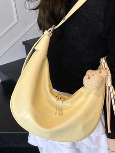Chic cream dumpling shoulder bag with crocodile texture and cute plush bear charm decoration