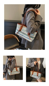 Detail of bohemian woven tote bag showing multi-color zigzag texture and leather handles