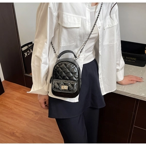 Chic quilted mini backpack with metal chain straps and front pocket for daily style